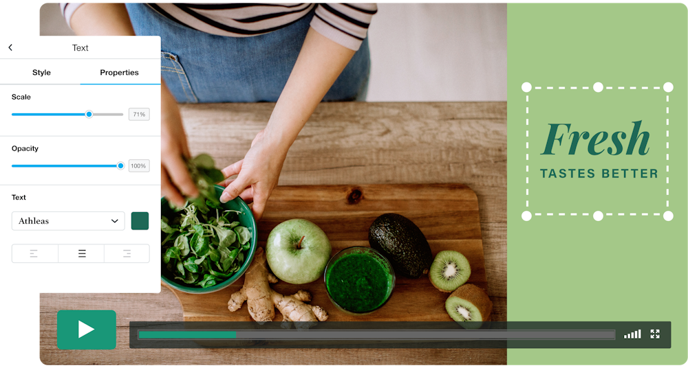 An image of a paused video screen being customized within Vimeo Create. A woman at a kitchen counter or table holds leafy greens over a bowl. She is surrounded by other healthy ingredients like kiwi, ginger, an apple, and an avocado. Text on the screen reads, "Fresh tastes better."